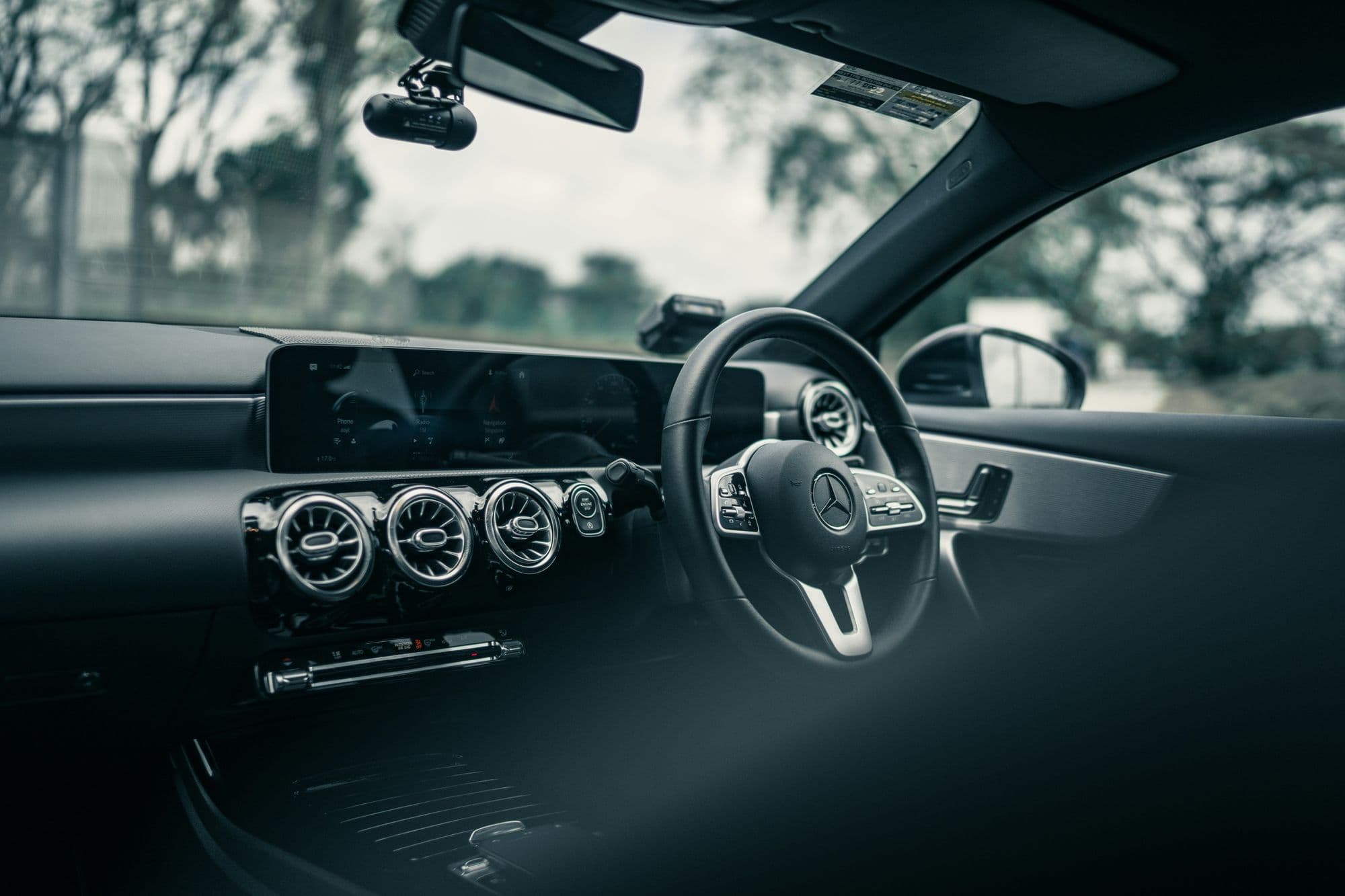The steering wheel and dashboard from the driver's side